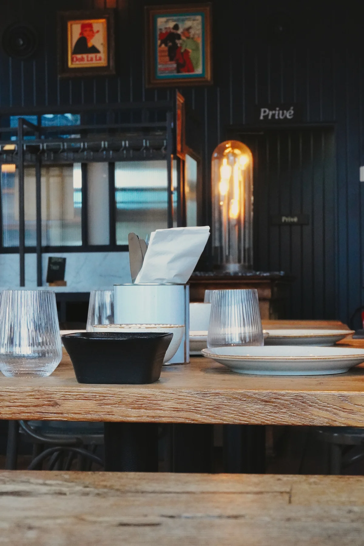 Table setting and restaurant bar in the background